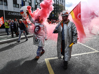 Metalworkers demonstrate as they march with banners and flags in the streets of Paris on October 13, 2017. Several thousand workers have tak...