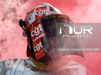 Metalworkers demonstrate as they march with banners and flags in the streets of Paris on October 13, 2017. Several thousand workers have tak...