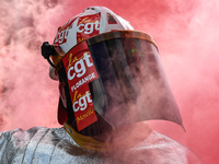 Metalworkers demonstrate as they march with banners and flags in the streets of Paris on October 13, 2017. Several thousand workers have tak...