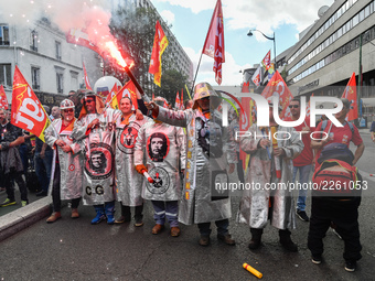 Metalworkers demonstrate as they march with banners and flags in the streets of Paris on October 13, 2017. Several thousand workers have tak...