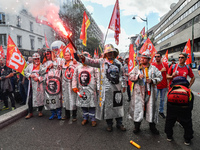 Metalworkers demonstrate as they march with banners and flags in the streets of Paris on October 13, 2017. Several thousand workers have tak...