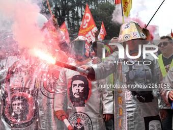 Metalworkers demonstrate as they march with banners and flags in the streets of Paris on October 13, 2017. Several thousand workers have tak...