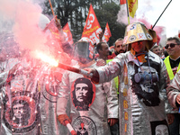 Metalworkers demonstrate as they march with banners and flags in the streets of Paris on October 13, 2017. Several thousand workers have tak...