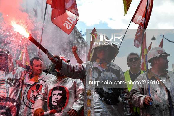 Metalworkers demonstrate as they march with banners and flags in the streets of Paris on October 13, 2017. Several thousand workers have tak...