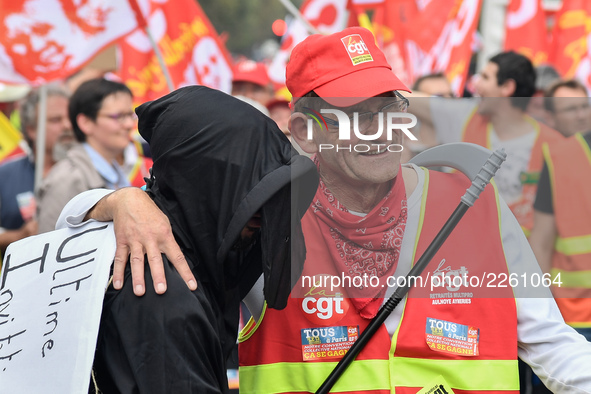 Metalworkers demonstrate as they march with banners and flags in the streets of Paris on October 13, 2017. Several thousand workers have tak...