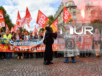 Metalworkers demonstrate as they march with banners and flags in the streets of Paris on October 13, 2017. Several thousand workers have tak...