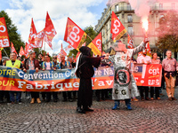 Metalworkers demonstrate as they march with banners and flags in the streets of Paris on October 13, 2017. Several thousand workers have tak...