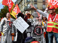 Metalworkers demonstrate as they march with banners and flags in the streets of Paris on October 13, 2017. Several thousand workers have tak...