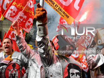 Metalworkers demonstrate as they march with banners and flags in the streets of Paris on October 13, 2017. Several thousand workers have tak...