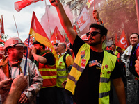 Metalworkers demonstrate as they march with banners and flags in the streets of Paris on October 13, 2017. Several thousand workers have tak...