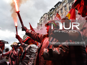 Metalworkers demonstrate as they march with banners and flags in the streets of Paris on October 13, 2017. Several thousand workers have tak...