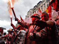 Metalworkers demonstrate as they march with banners and flags in the streets of Paris on October 13, 2017. Several thousand workers have tak...