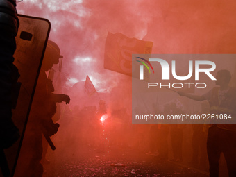 Metalworkers demonstrate as they march with banners and flags in the streets of Paris on October 13, 2017. Several thousand workers have tak...