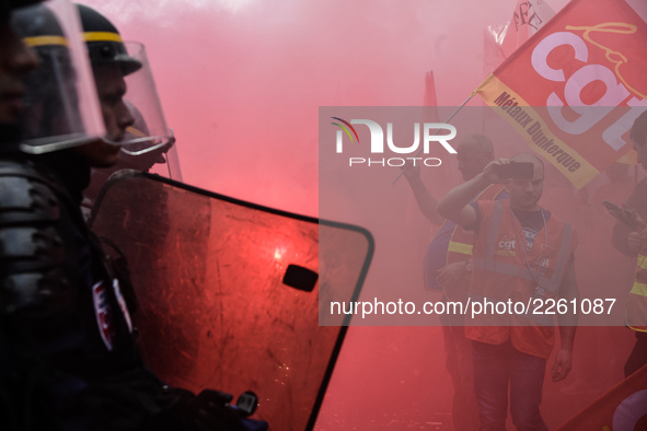 Metalworkers demonstrate as they march with banners and flags in the streets of Paris on October 13, 2017. Several thousand workers have tak...