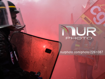 Metalworkers demonstrate as they march with banners and flags in the streets of Paris on October 13, 2017. Several thousand workers have tak...