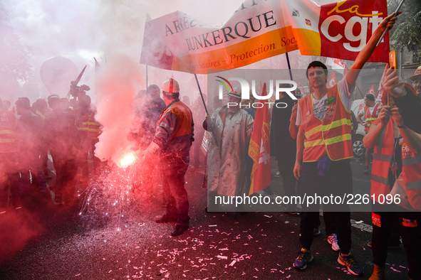 Metalworkers demonstrate as they march with banners and flags in the streets of Paris on October 13, 2017. Several thousand workers have tak...