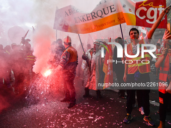 Metalworkers demonstrate as they march with banners and flags in the streets of Paris on October 13, 2017. Several thousand workers have tak...