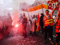 Metalworkers demonstrate as they march with banners and flags in the streets of Paris on October 13, 2017. Several thousand workers have tak...