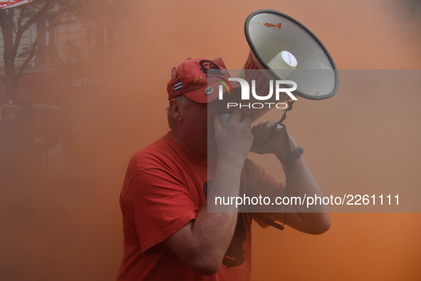 Metalworkers demonstrate as they march with banners and flags in the streets of Paris on October 13, 2017. Several thousand workers have tak...