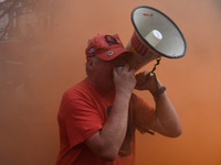 Metalworkers demonstrate as they march with banners and flags in the streets of Paris on October 13, 2017. Several thousand workers have tak...