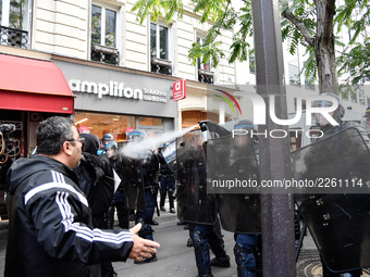 Metallurgy workers clashes with anti-riot police in the streets of Paris on October 13, 2017. Several thousand workers have taken part in a...