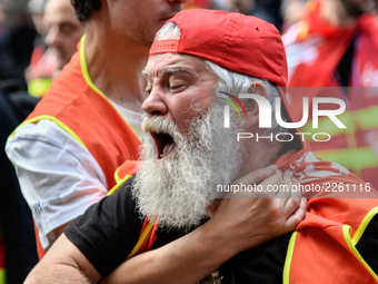 Metalworkers demonstrate as they march with banners and flags in the streets of Paris on October 13, 2017. Several thousand workers have tak...