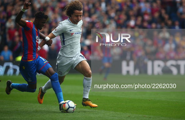 Crystal Palace's Wilfried Zaha takes on Chelsea's David Luiz
during Premier League  match between Crystal Palace and Chelsea at Selhurst Pa...