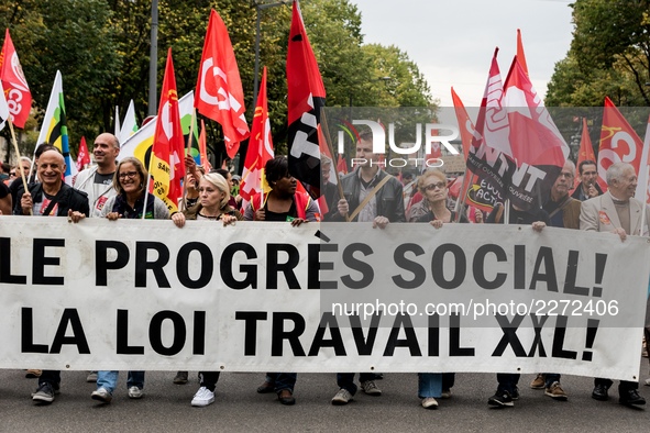 People march behind a banner as thousands gather in the streets of Lyon, France to protest against the labor law at the call of the CGT, the...