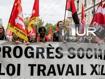 People march behind a banner as thousands gather in the streets of Lyon, France to protest against the labor law at the call of the CGT, the...