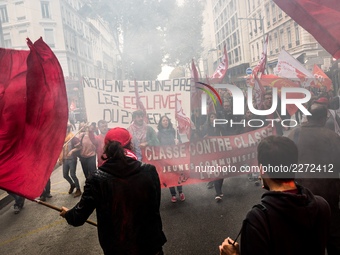 People march behind a banner as thousands gather in the streets of Lyon, France to protest against the labor law at the call of the CGT, the...