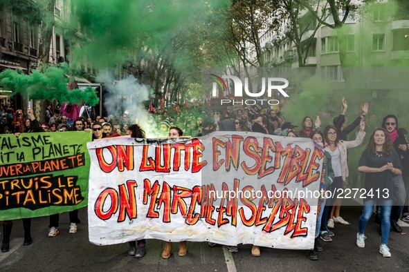 People march behind a banner as thousands gather in the streets of Lyon, France to protest against the labor law at the call of the CGT, the...