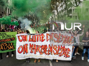 People march behind a banner as thousands gather in the streets of Lyon, France to protest against the labor law at the call of the CGT, the...