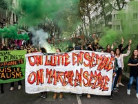 People march behind a banner as thousands gather in the streets of Lyon, France to protest against the labor law at the call of the CGT, the...