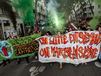 People march behind a banner as thousands gather in the streets of Lyon, France to protest against the labor law at the call of the CGT, the...