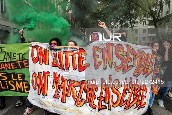 People march behind a banner as thousands gather in the streets of Lyon, France to protest against the labor law at the call of the CGT, the...