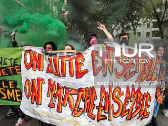 People march behind a banner as thousands gather in the streets of Lyon, France to protest against the labor law at the call of the CGT, the...