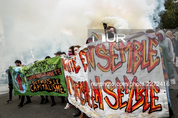 People march behind a banner as thousands gather in the streets of Lyon, France to protest against the labor law at the call of the CGT, the...