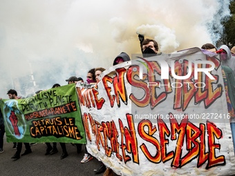 People march behind a banner as thousands gather in the streets of Lyon, France to protest against the labor law at the call of the CGT, the...