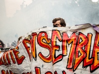 People march behind a banner as thousands gather in the streets of Lyon, France to protest against the labor law at the call of the CGT, the...