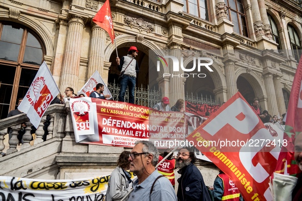 People march behind a banner as thousands gather in the streets of Lyon, France to protest against the labor law at the call of the CGT, the...