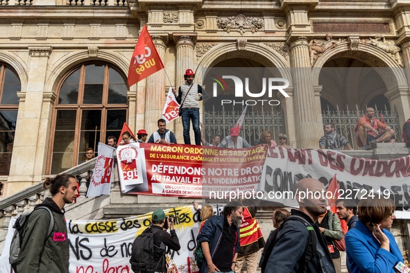 People march behind a banner as thousands gather in the streets of Lyon, France to protest against the labor law at the call of the CGT, the...