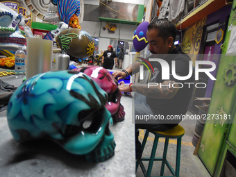 Workers of the 'Taller el Volador' made  the manufacture of skulls and catrinas that will be used for the Day of the Dead Parade inspired by...