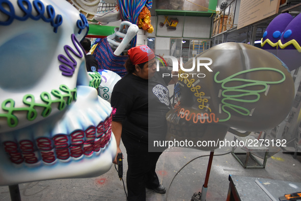 Workers of the 'Taller el Volador' made  the manufacture of skulls and catrinas that will be used for the Day of the Dead Parade inspired by...