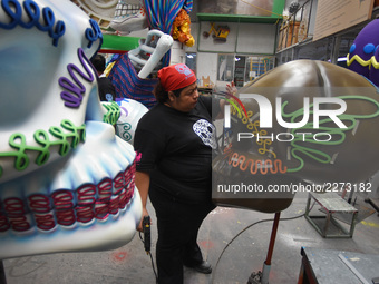 Workers of the 'Taller el Volador' made  the manufacture of skulls and catrinas that will be used for the Day of the Dead Parade inspired by...