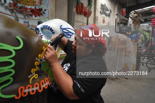 Workers of the 'Taller el Volador' made  the manufacture of skulls and catrinas that will be used for the Day of the Dead Parade inspired by...