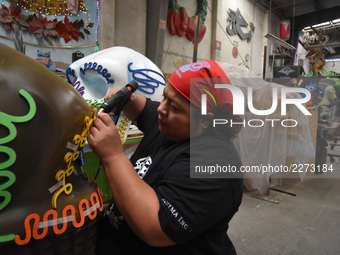 Workers of the 'Taller el Volador' made  the manufacture of skulls and catrinas that will be used for the Day of the Dead Parade inspired by...