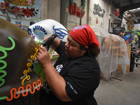 Workers of the 'Taller el Volador' made  the manufacture of skulls and catrinas that will be used for the Day of the Dead Parade inspired by...