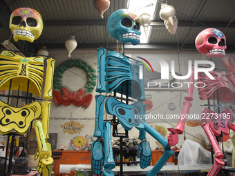 Workers of the 'Taller el Volador' made  the manufacture of skulls and catrinas that will be used for the Day of the Dead Parade inspired by...