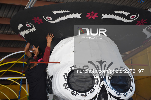 Workers of the 'Taller el Volador' made  the manufacture of skulls and catrinas that will be used for the Day of the Dead Parade inspired by...