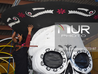 Workers of the 'Taller el Volador' made  the manufacture of skulls and catrinas that will be used for the Day of the Dead Parade inspired by...